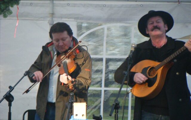 Musicians celebrating Wren Day in local woods.